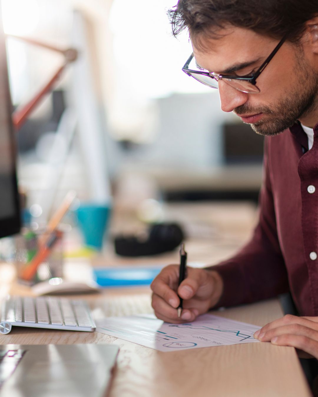 Person sketching a plan and roadmap at their desk